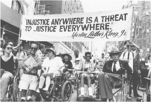Justin Dart, father of the ADA, marching for civil rights with other people with disabilities